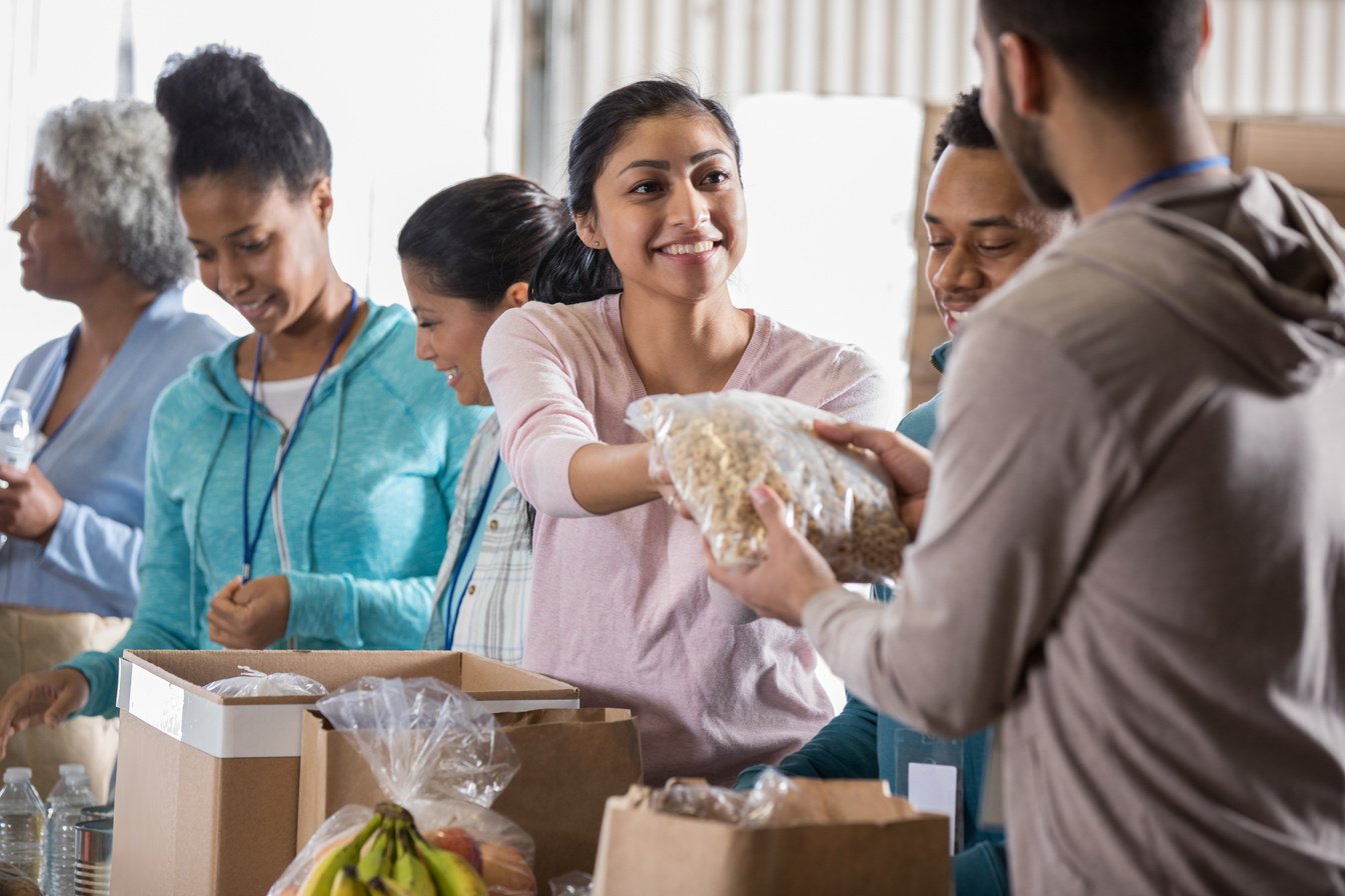 Young woman volunteering in food bank